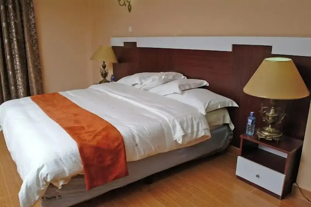 The Coconut Grill Hotel - Chambres