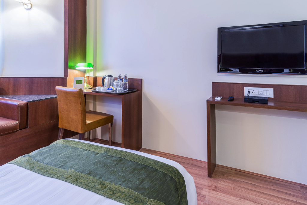 Treebo Premium Grand Emerald - Chambres