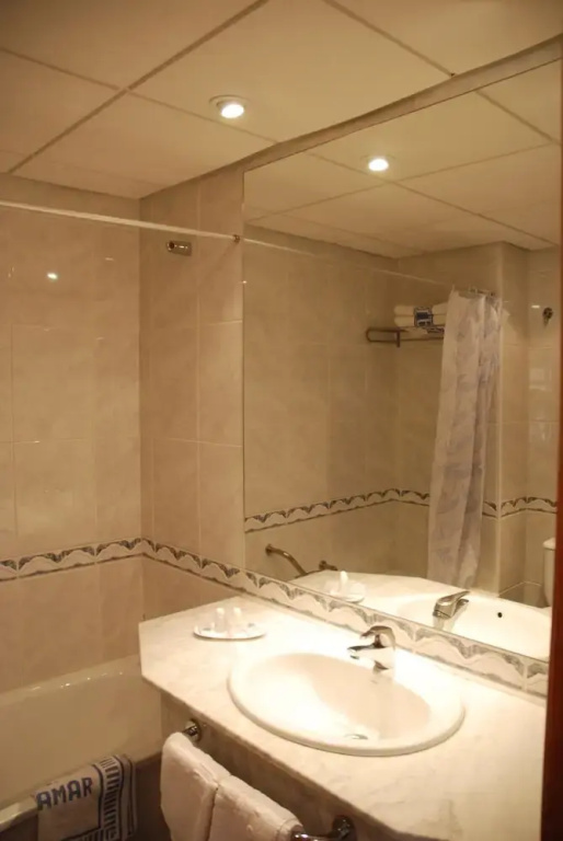 Standard Triple room with balcony and with partial sea view
