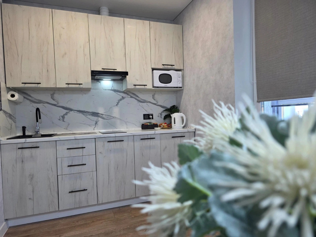 Квартира с дизайнерским ремонтом и подземным паркингом — фото