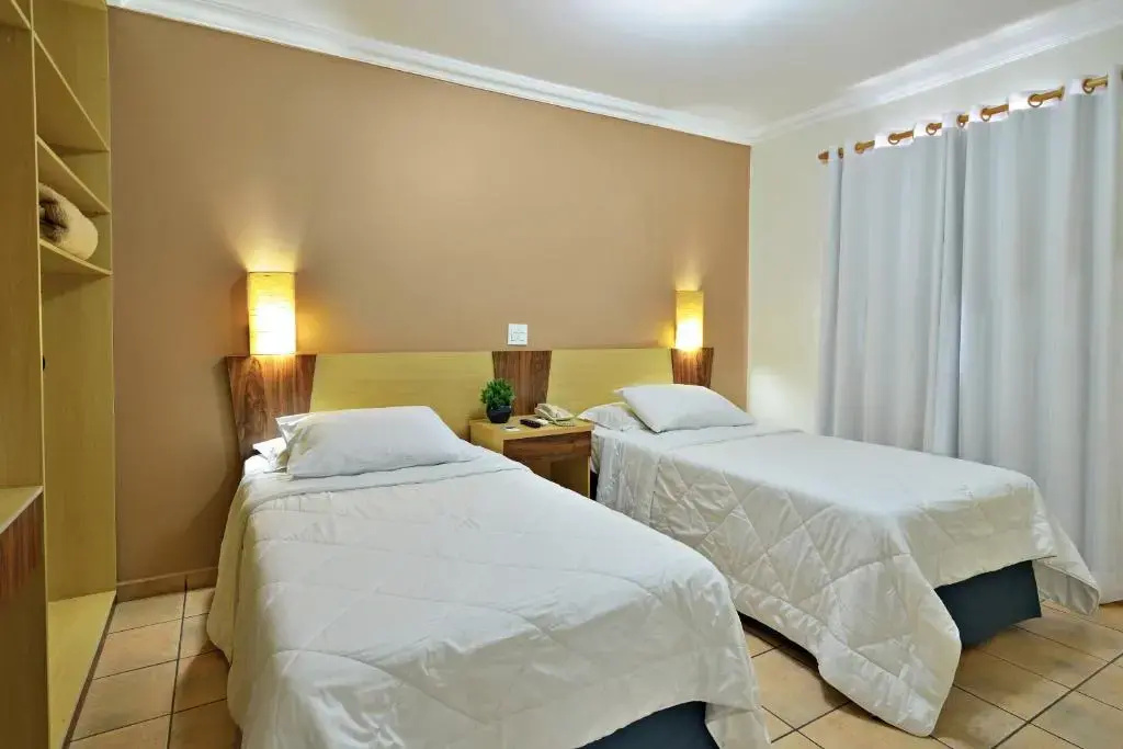 Plaza Inn Flat Araxá - Chambres