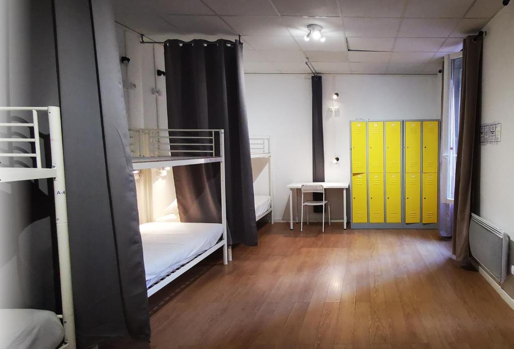 Кровать в общем номере в Le Coffice Auberge de Jeunesse