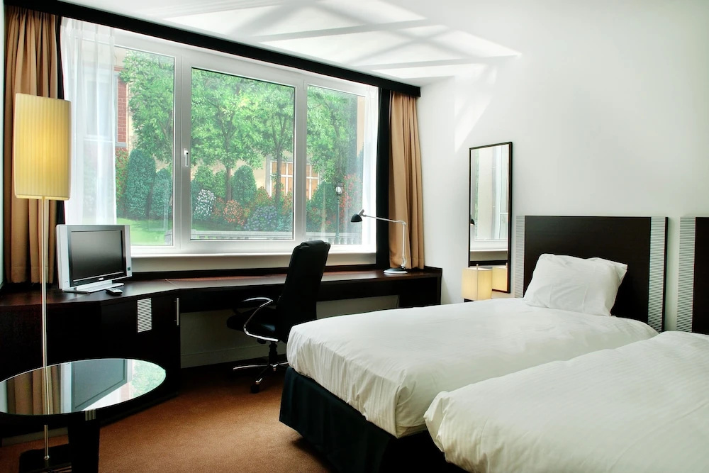 Progress Hotel - Chambres