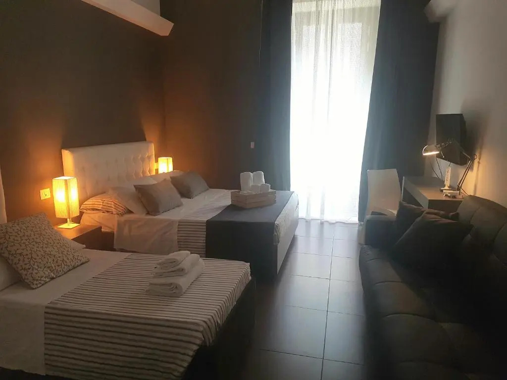 Deluxe Quadruple room with balcony