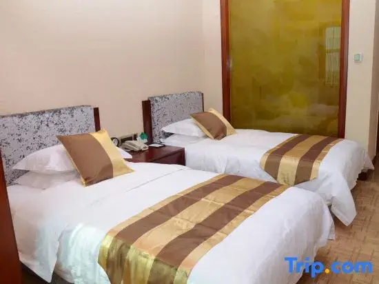 Yi Long Hotel - Chambres