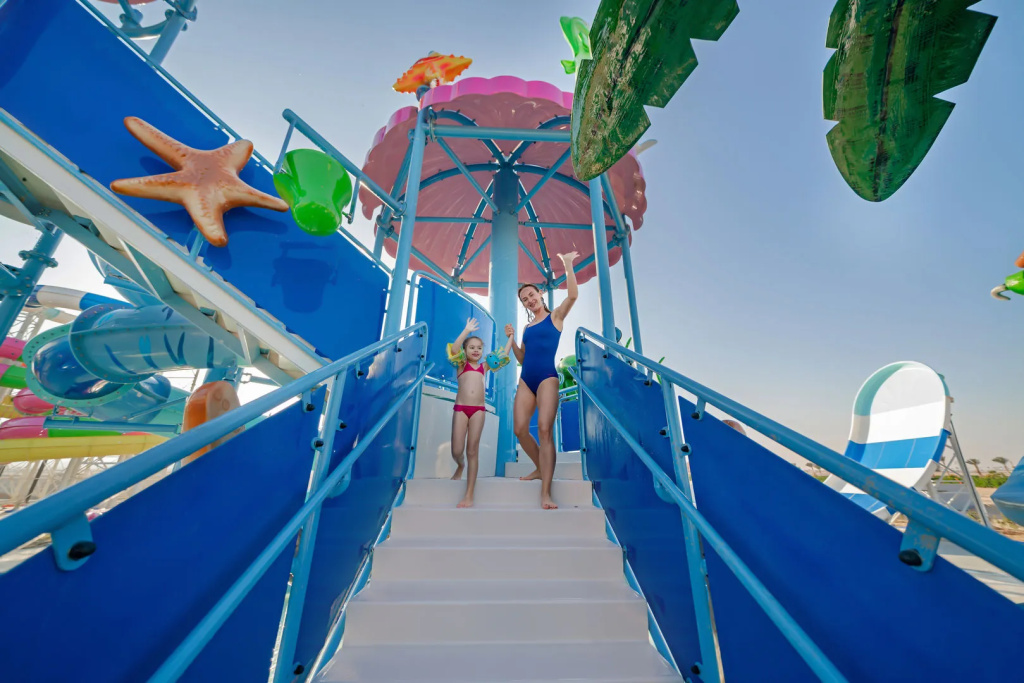 Mövenpick Waterpark Resort & Spa Soma Bay: A colorful waterpark slide tower with stairs and playful sea-themed features.