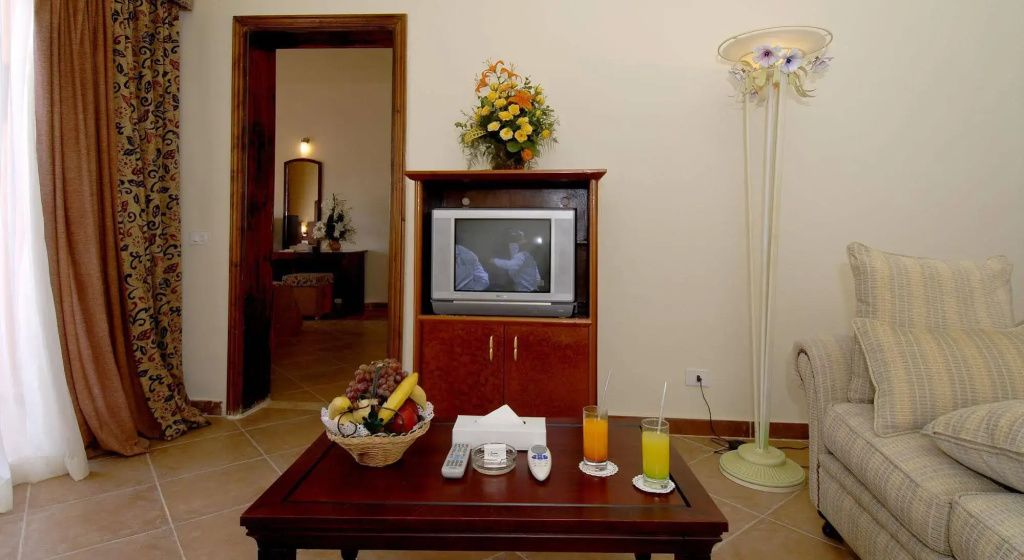 Nubian Island, Families and Couples only: A comfortable sitting area with a sofa, television, and coffee table.