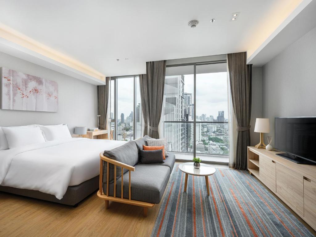Двухместная студия Deluxe с 2 комнатами 2 отдельные кровати в Oakwood Suites Bangkok