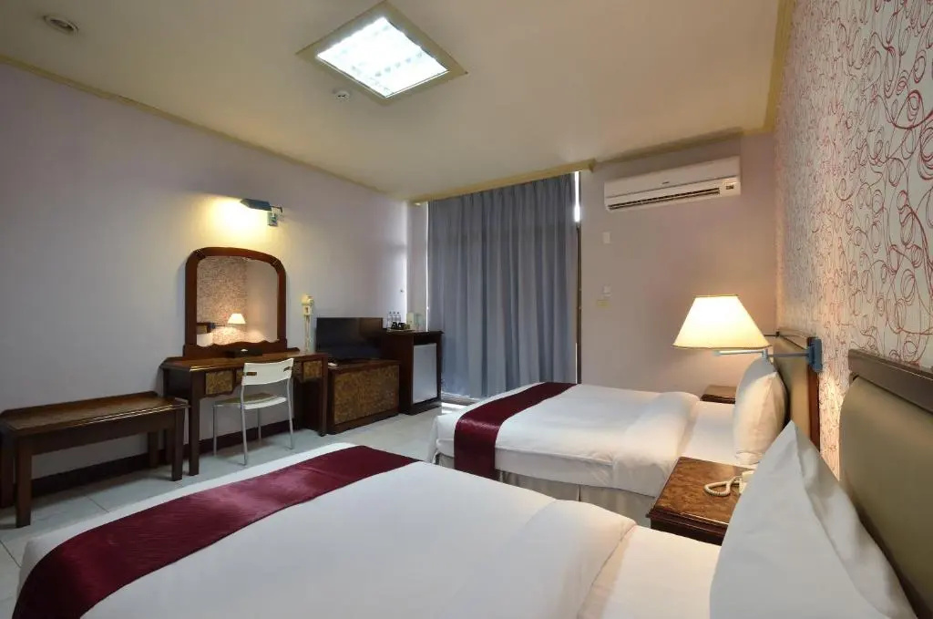 Jiuning Business Hotel - Chambres