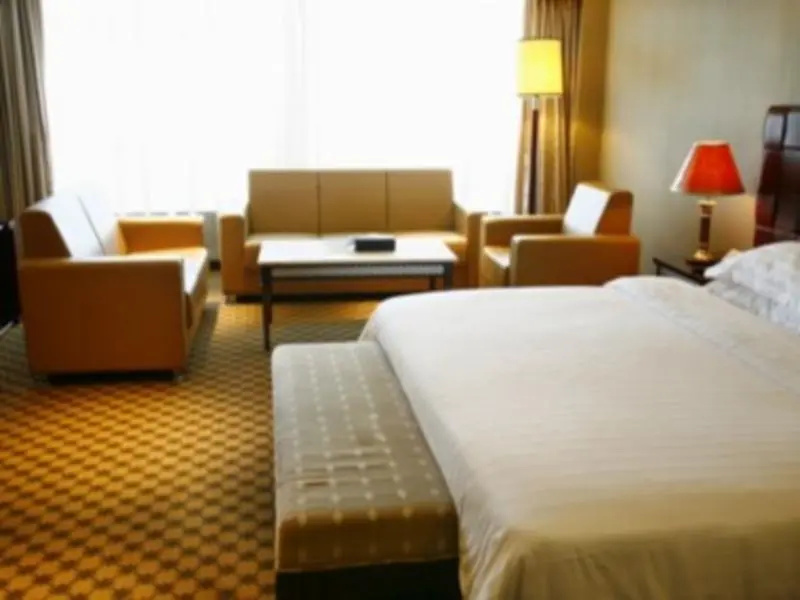Huaweida Hotel - Chambres