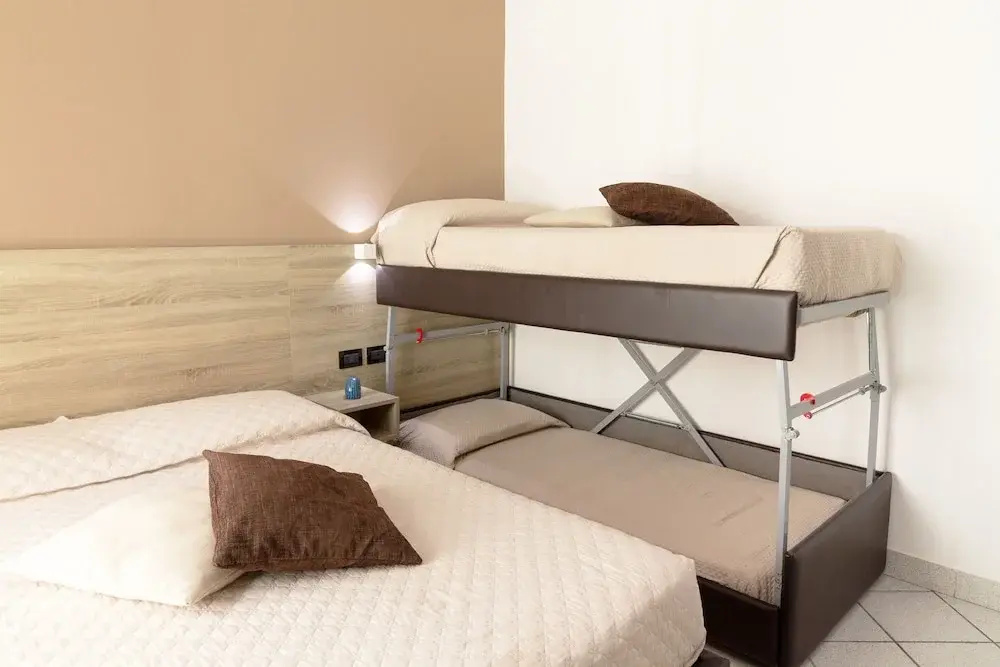 Standard Quadruple room with courtyard view