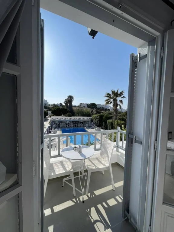 Superior Triple room with balcony and with pool view