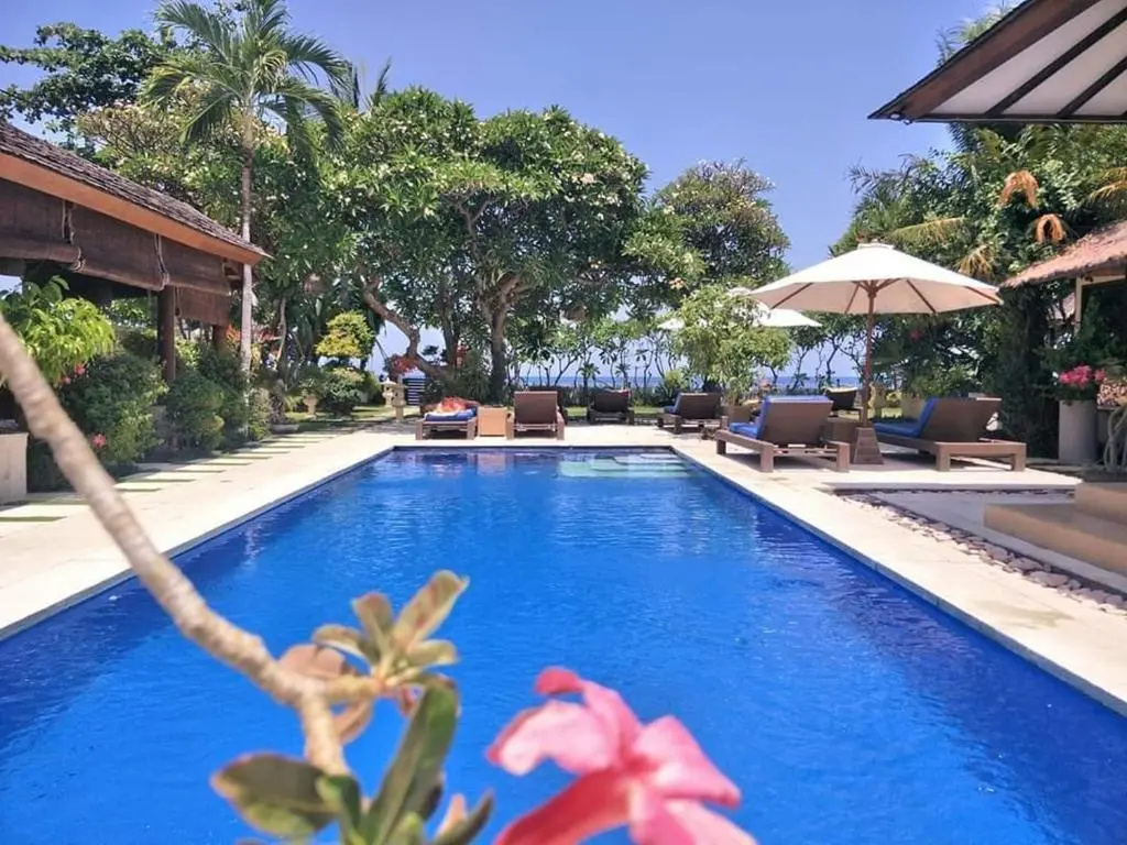 Frangipani Beach Hotel - Tap to explore photos