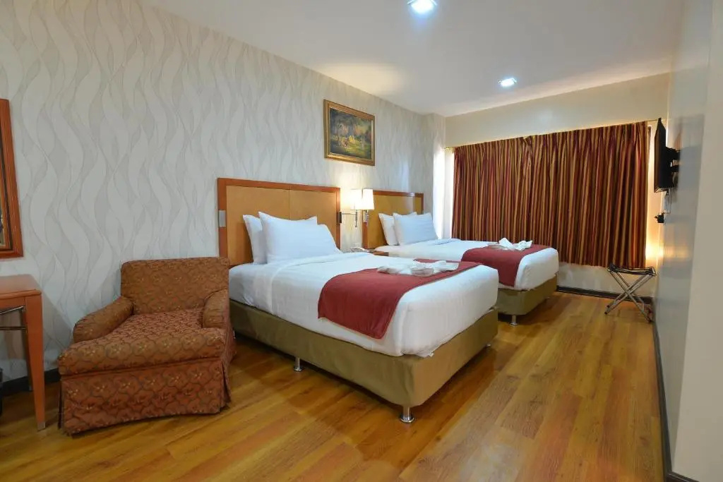 Royal Suites Condotel - Chambres