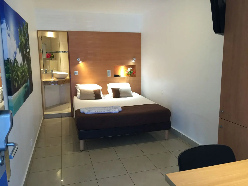 Voir la photo 2 — Karaibes Hotel