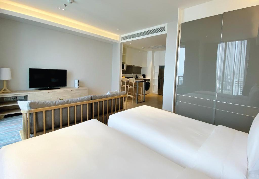 Двухместная студия Deluxe 2 отдельные кровати в Oakwood Suites Bangkok