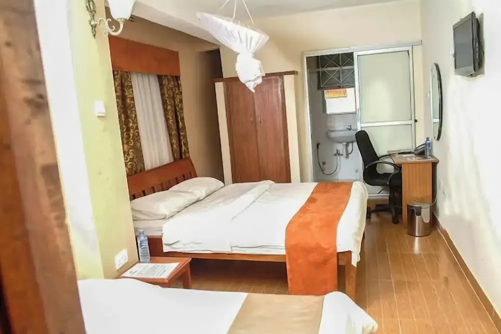 The Coconut Grill Hotel - Chambres