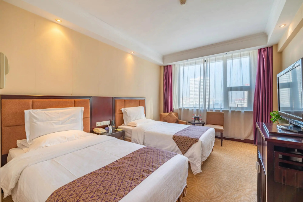 Lotus Huatian Hotel - Chambres