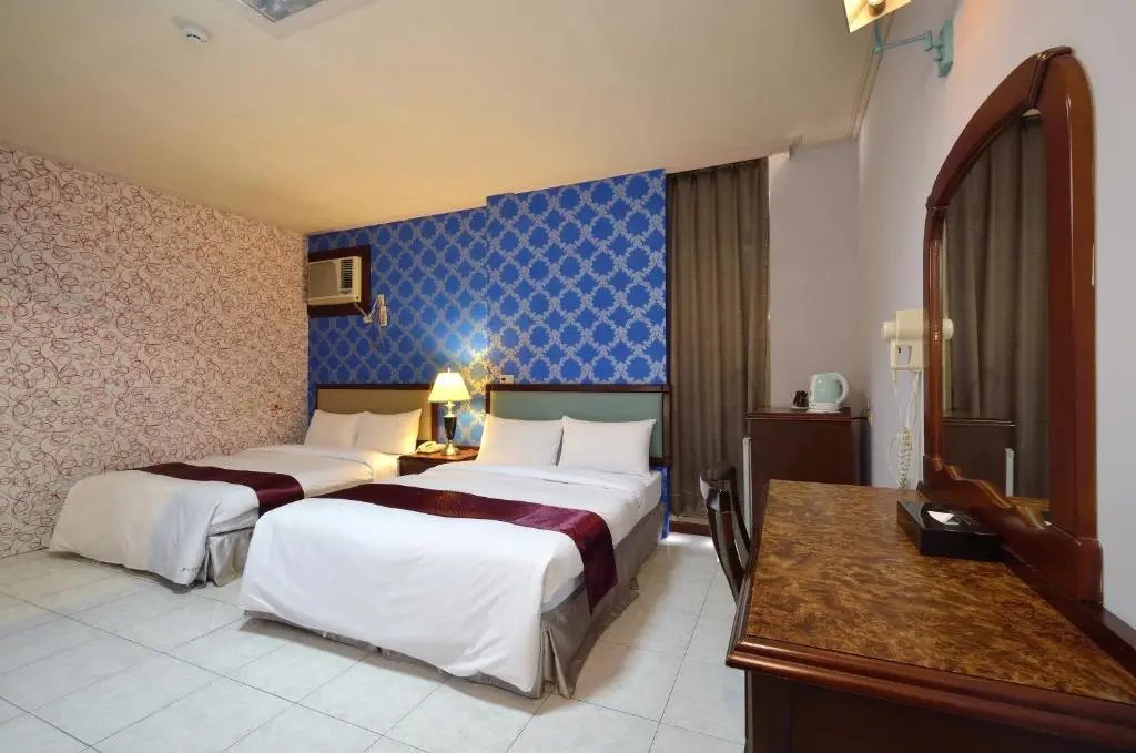 Jiuning Business Hotel - Chambres