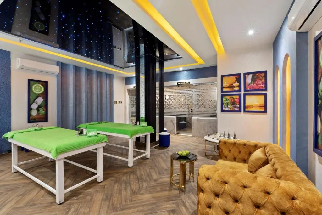 Pickalbatros Blu Spa Resort - Adults Friendly 16 Years Plus: A spa treatment room with massage tables, a seating area, and a steam bath entrance.