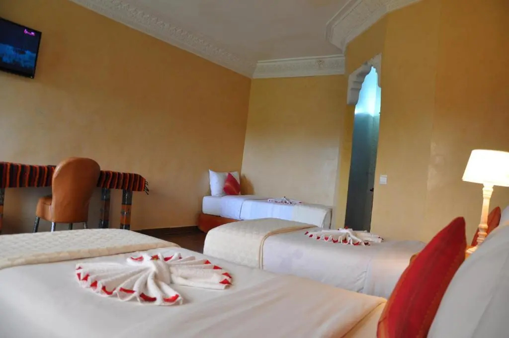 Standard Triple room with garden view