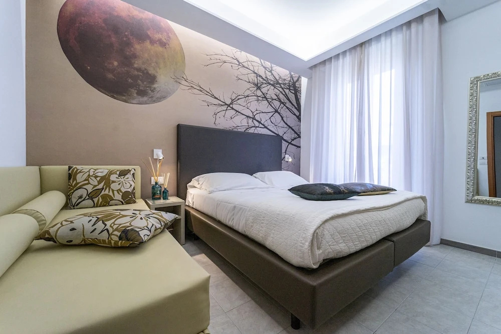 Deluxe Quadruple room with balcony and with sea view