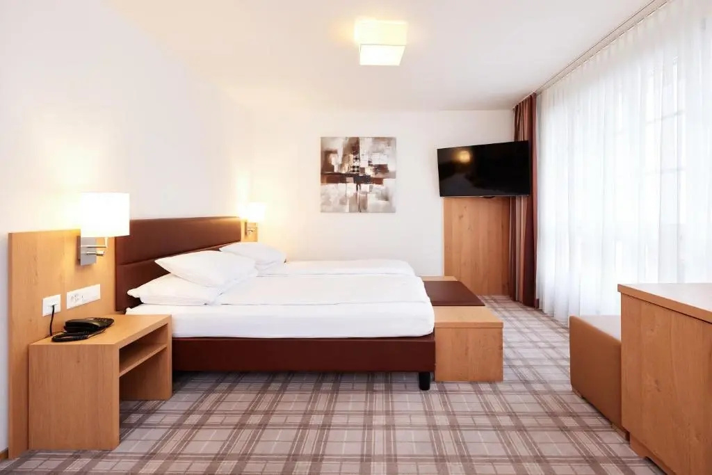 Central City Hotel Rochat - Chambres