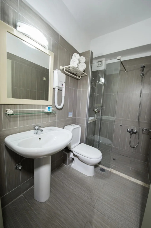 Astron Hotel - Chambres