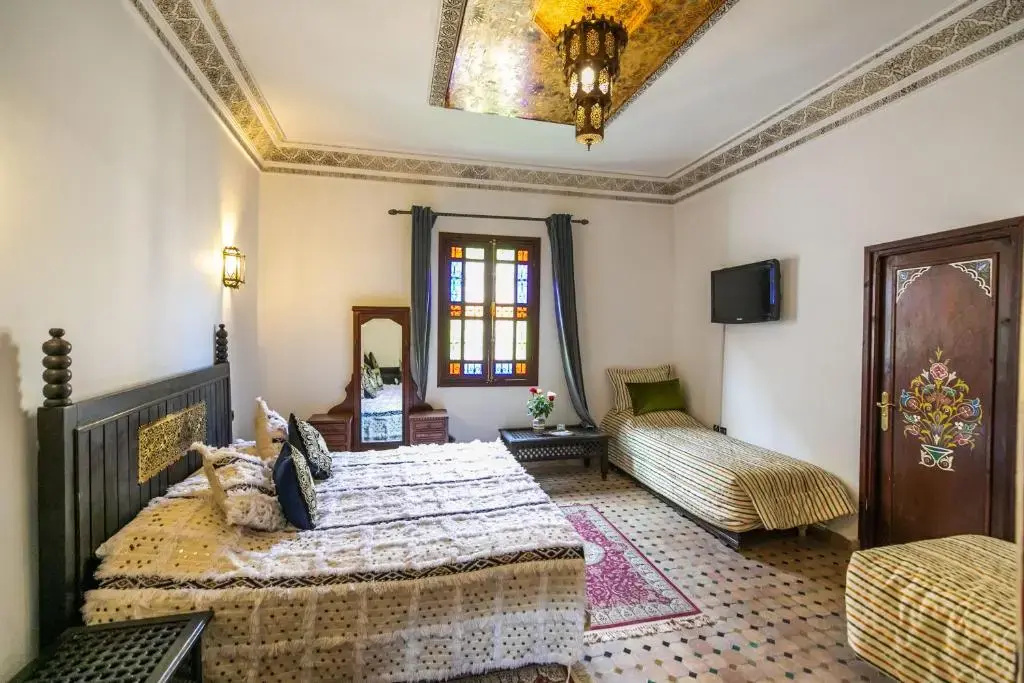 Standard Quadruple room with garden view