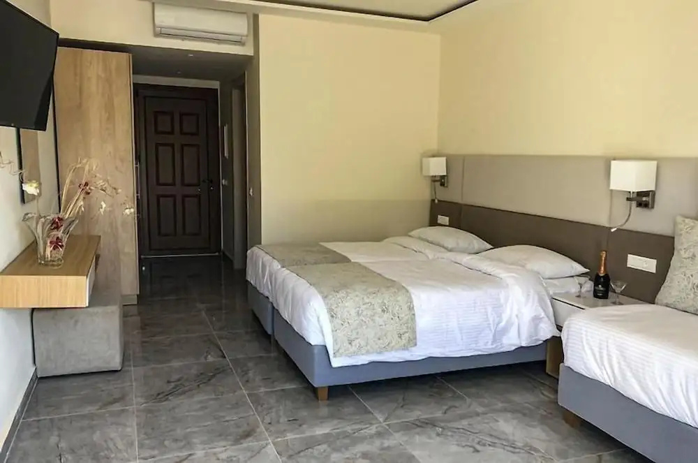 Superior Triple room with balcony and beachfront