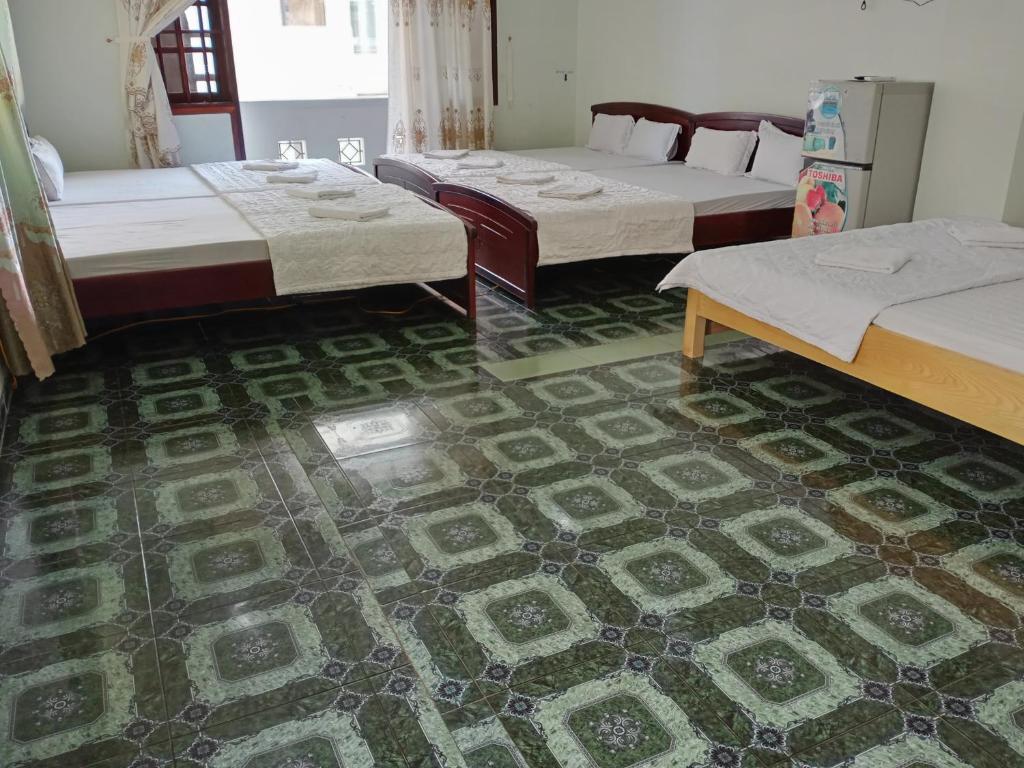 Кровать в общем номере в Vuta Hotel