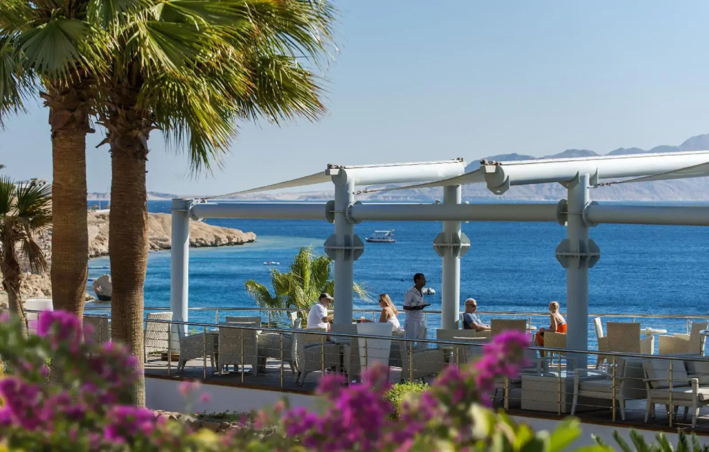 Concorde El Salam Hotel Sharm El Sheikh Sport Hotel: Relax on a shaded terrace with outdoor seating and views across the sea.