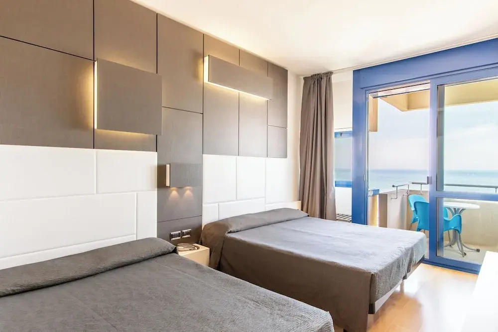 Deluxe Quadruple room with balcony and with sea view