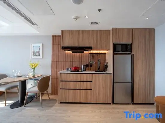 Jingguang Center Apartment Hotel - Chambres