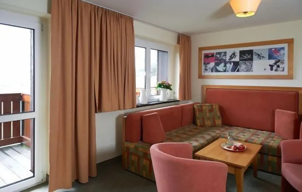 Jens Weissflog Appartementhotel - Chambres