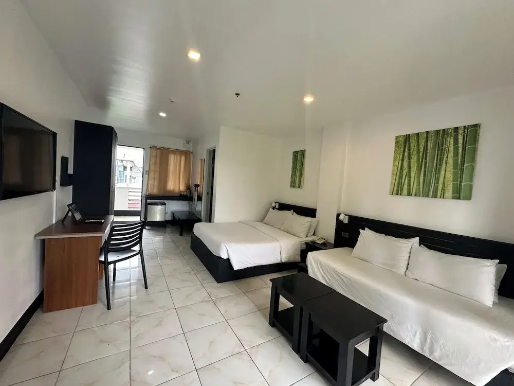 Standard Triple room with balcony and with garden view