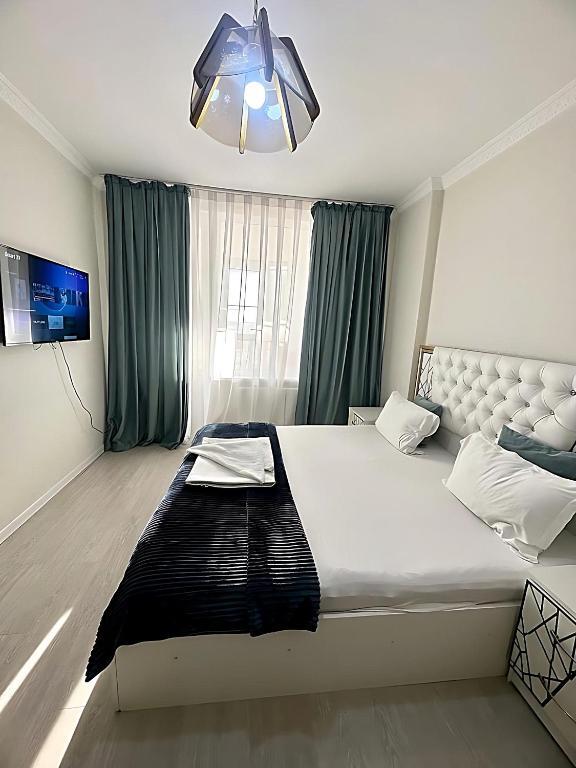 Апартаменты Kulmanova 107, apartments overlooking the city center! в Атырау