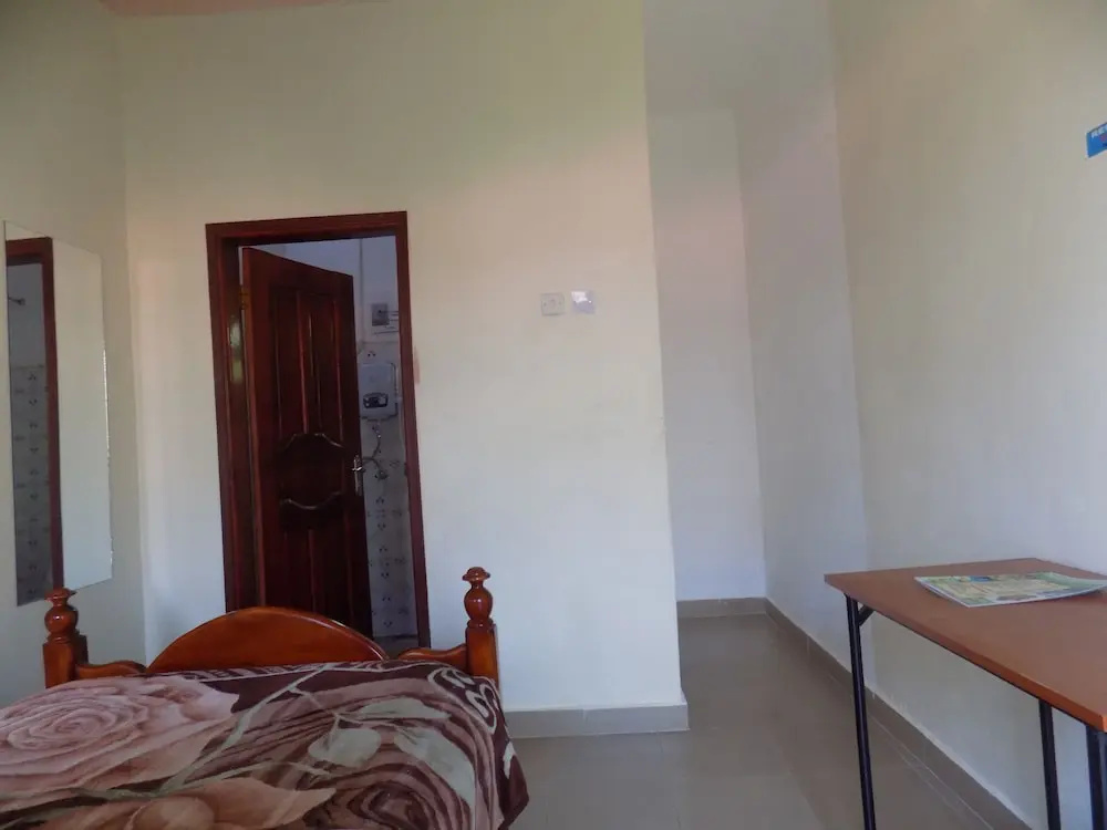 Deluxe Hotel - Ishaka - Chambres