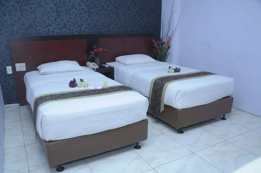 Griya Hotel - Chambres