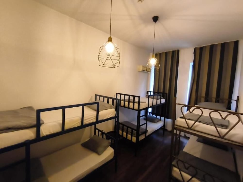 Bed in Dorm with balcony and with canal view