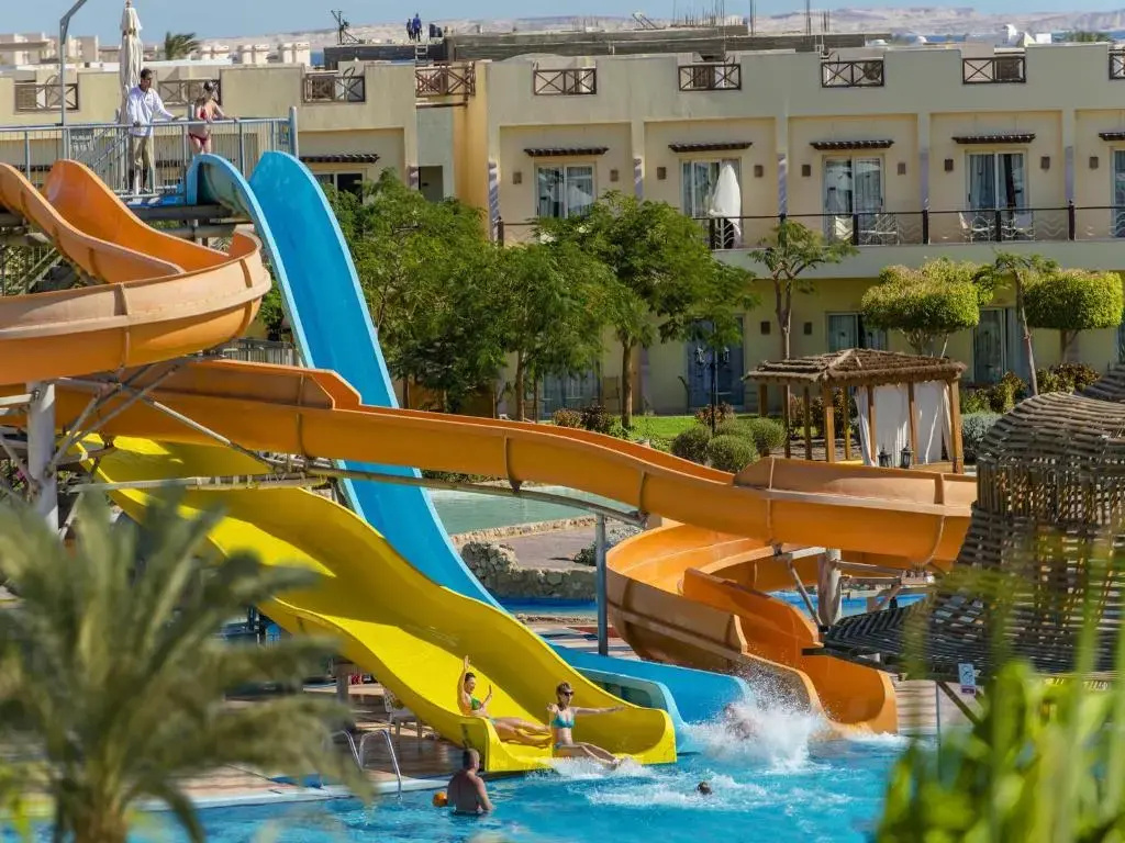 Concorde El Salam Hotel Sharm El Sheikh Sport Hotel: A lively outdoor pool area features several colorful water slides and hotel buildings in the background.