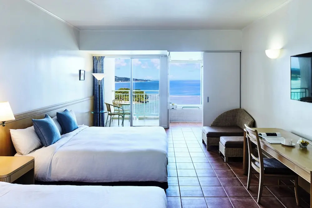 Deluxe Quadruple room with balcony and oceanfront