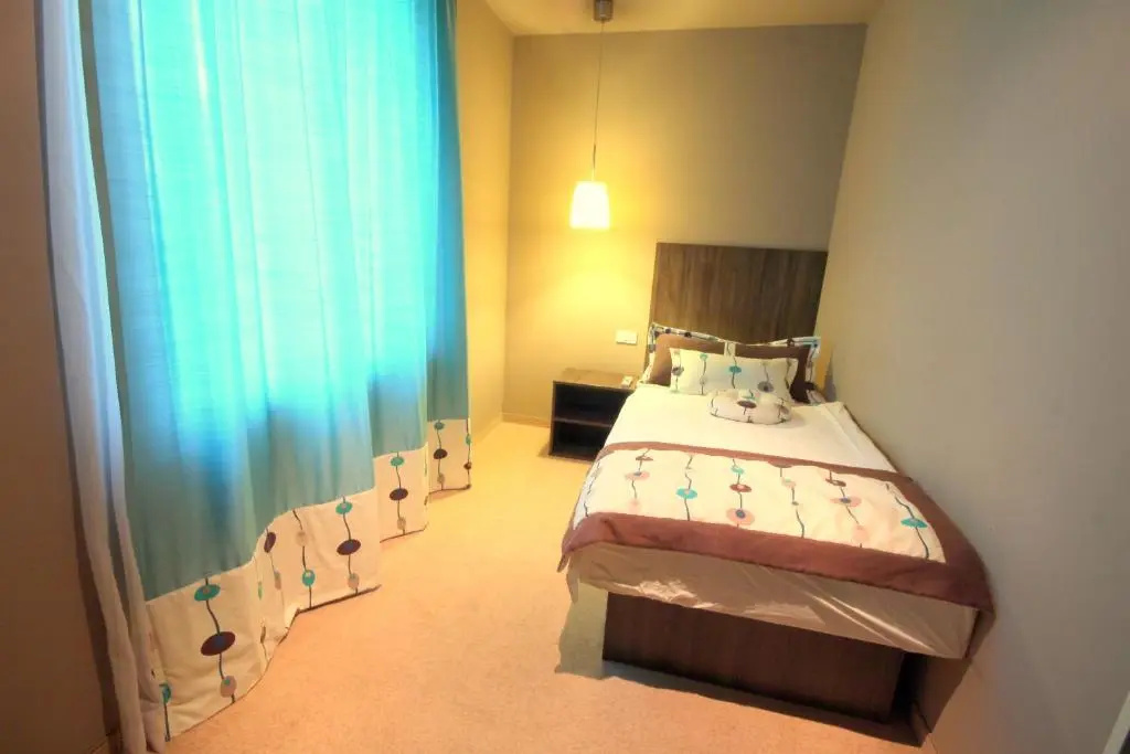 Ambient Hotel - Chambres