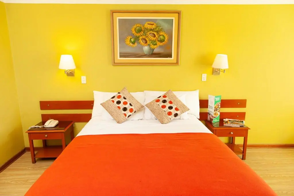 Hotel Holiday Suites - Chambres