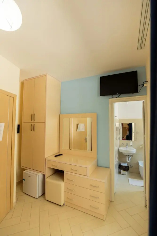 Standard Quadruple room with balcony and with partial sea view