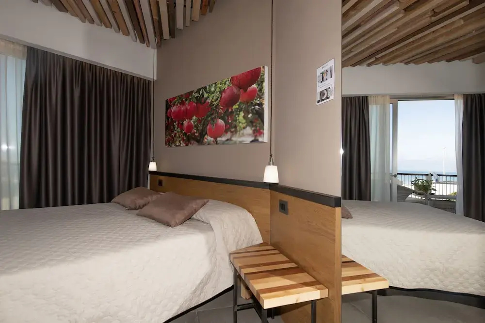 Deluxe Quadruple room with balcony and with sea view