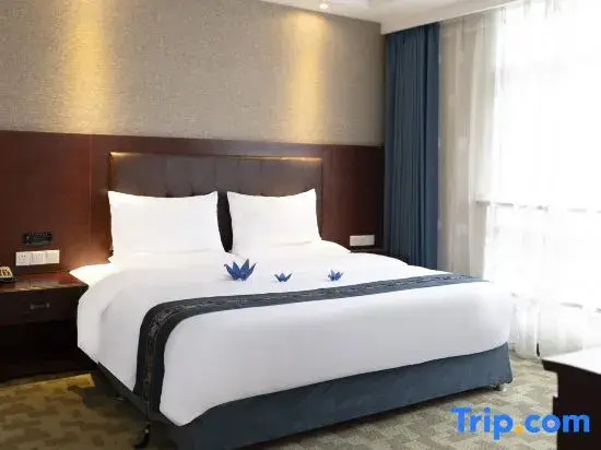 Harmonious Dunpu Hotel - Chambres