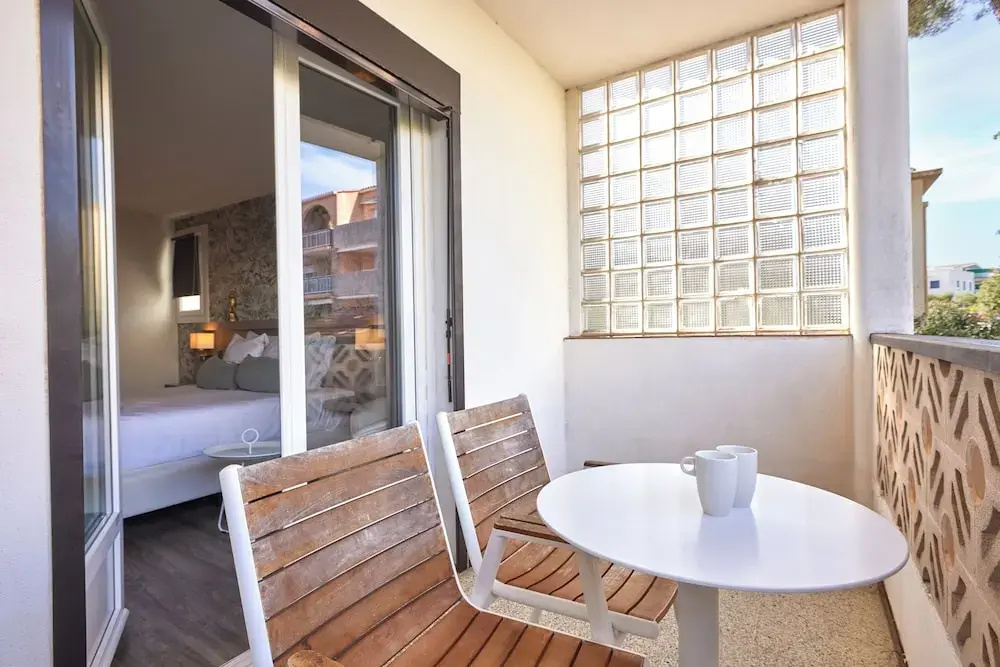 Standard Triple room with balcony and with garden view