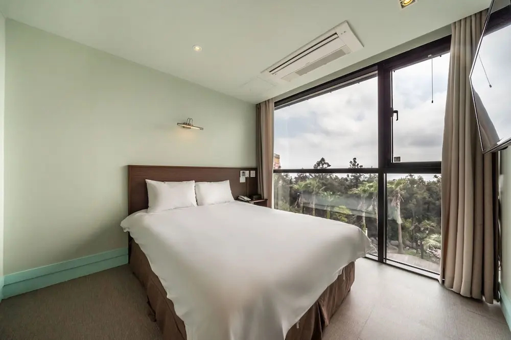 Sunrise Hotel Jungmun - Chambres