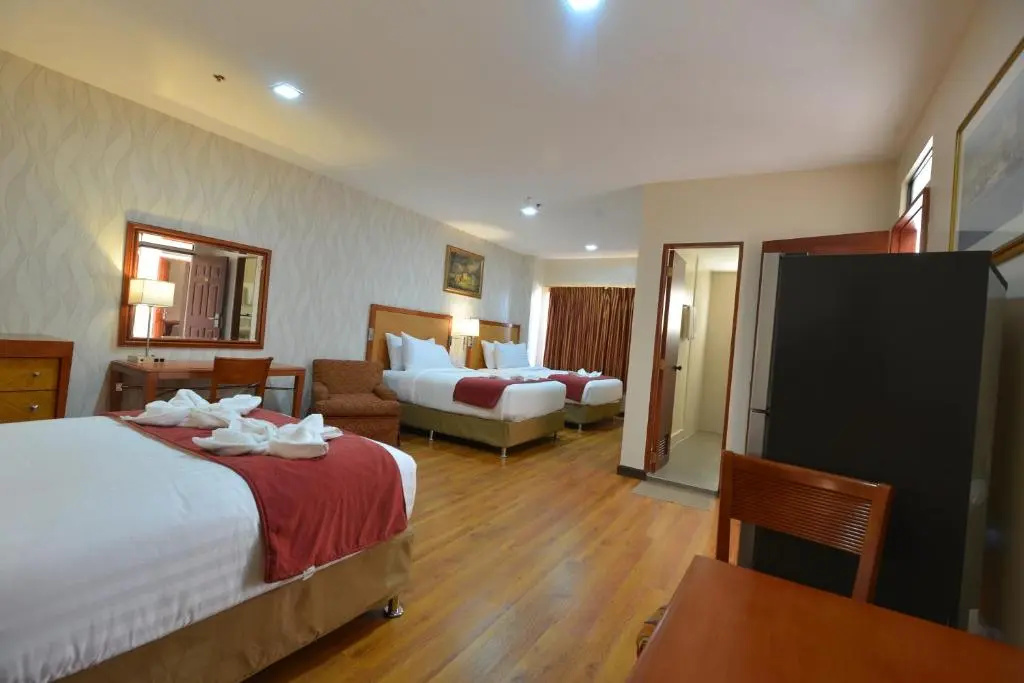 Royal Suites Condotel - Chambres